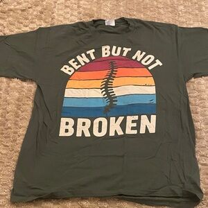 Green Graphic Tee with Colorful Design